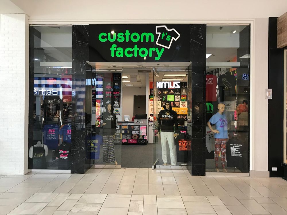 Custom T's Factory mall storefront from a public shop photo